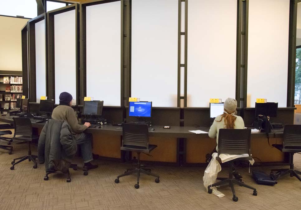Library patrons using public computers at the Northeast Branch