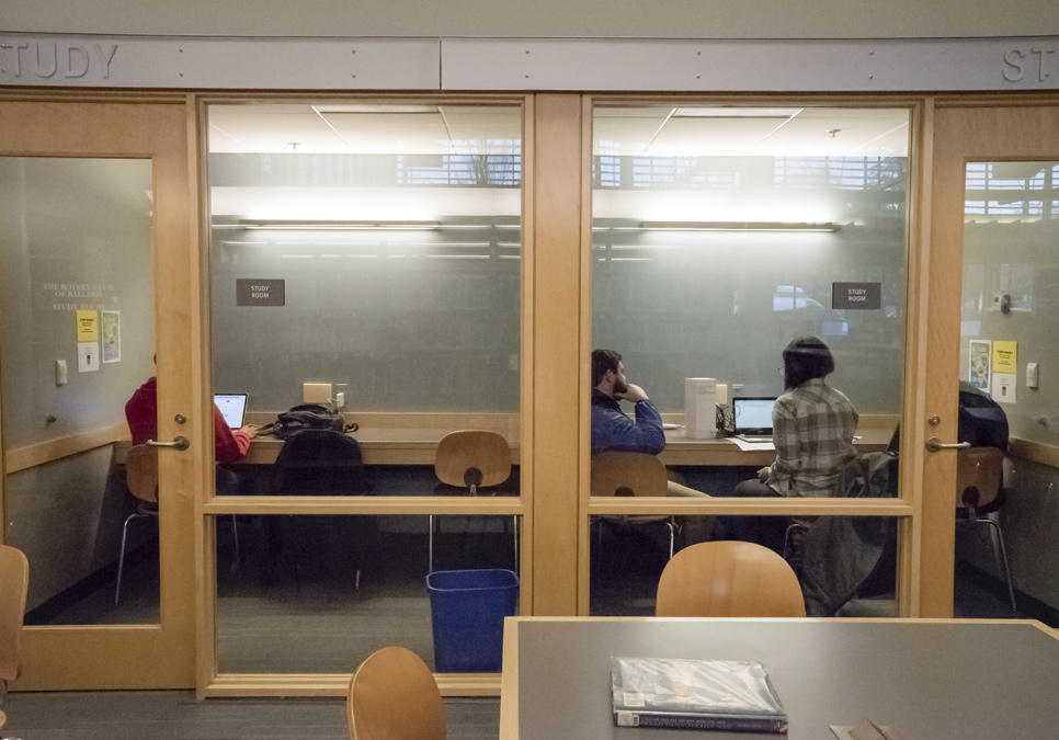 Library patrons using the study room area at the Ballard Branch