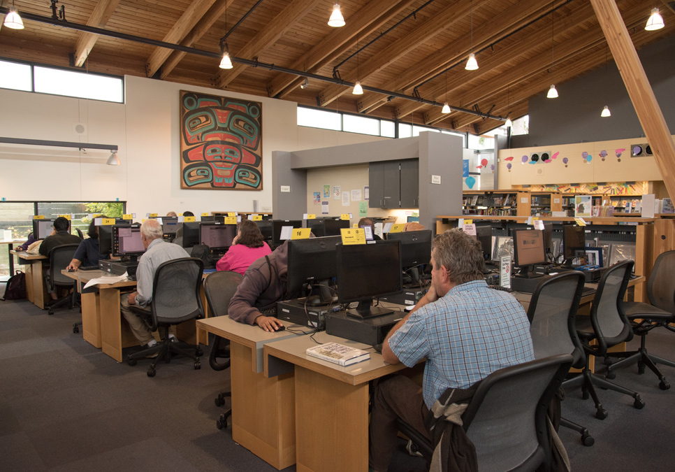 Library patrons in the public computer area at the Broadview Branch