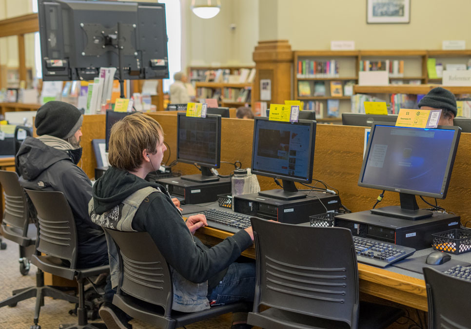 Library patrons using public computers at the Green Lake Branch