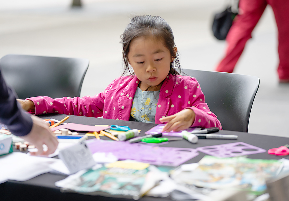 Patron crafting at art on the plaza event at the Central Library