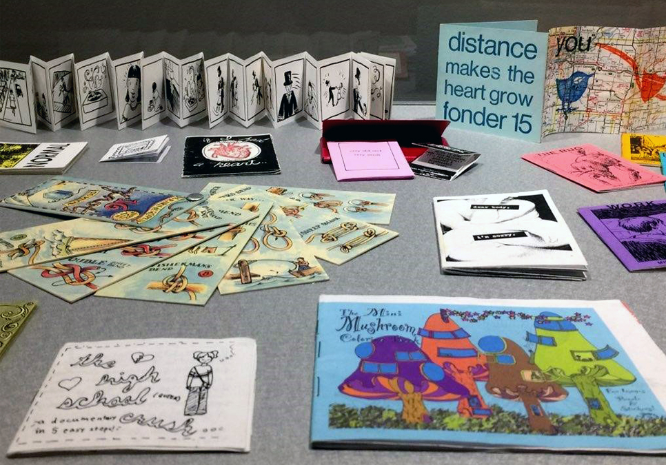 Zines arranged on a table.