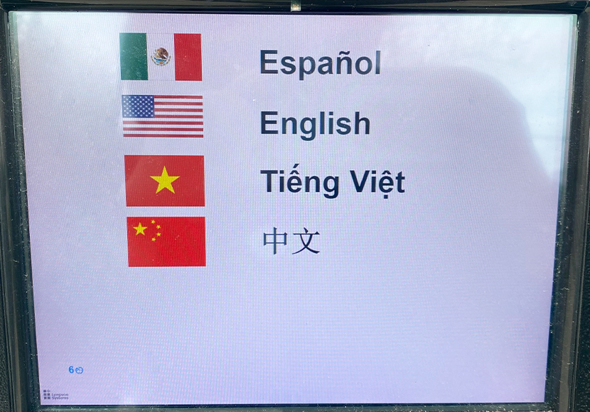 A locker touch screen showing language options.